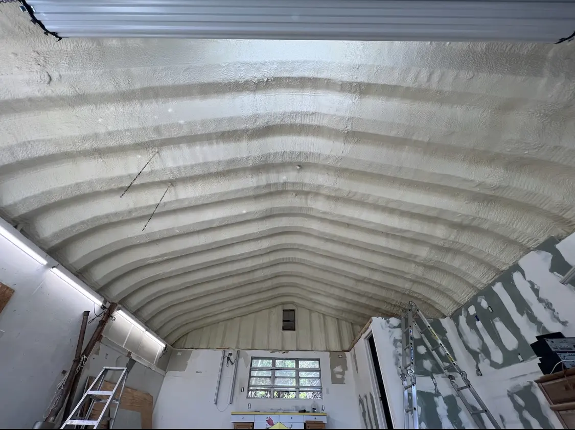 Spray polyurethane foam applied to the underside of a metal roof deck in Evans